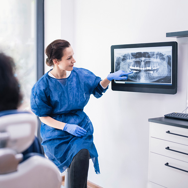 doctor showing patient xrays