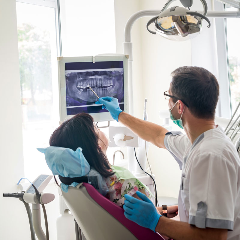 doctor showing patient xrays