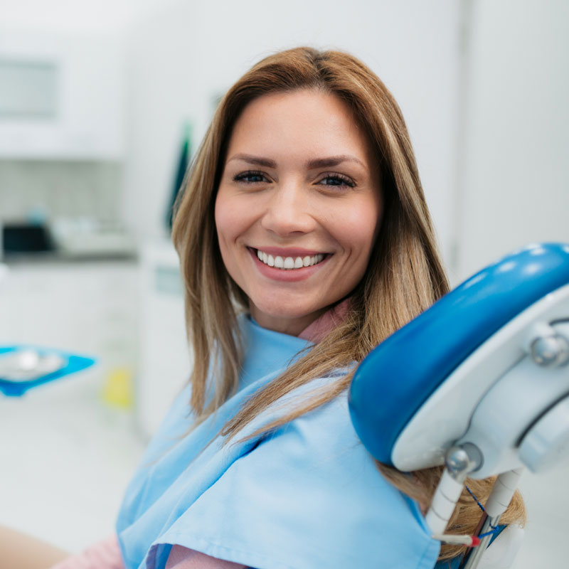 lady in dental chair smiling