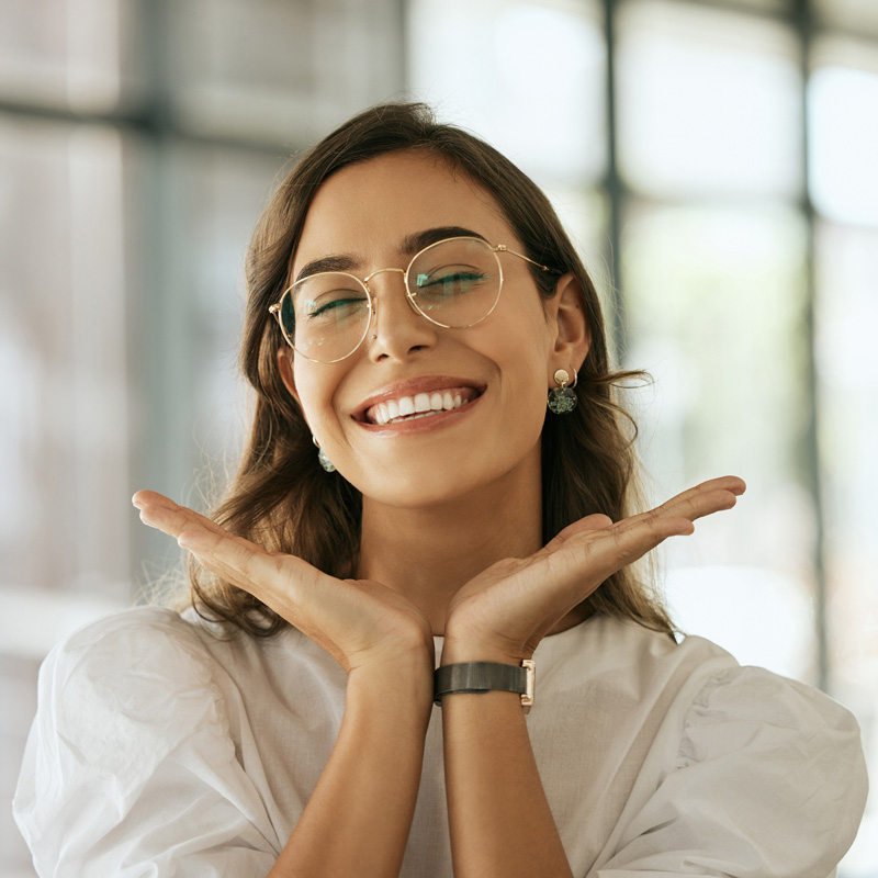 lady with glasses smiling