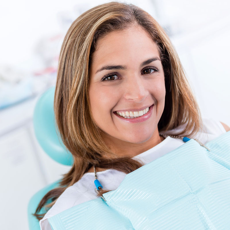 Woman at the dentist office smiling