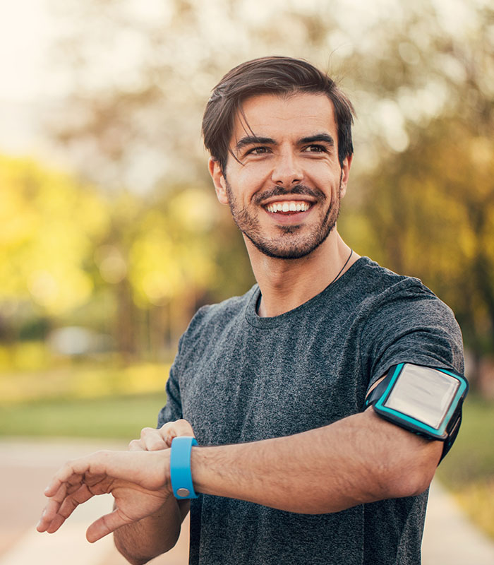 Man jogging and smiling