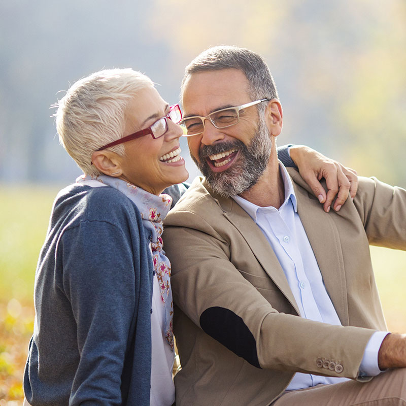 Elderly couple happily smiling